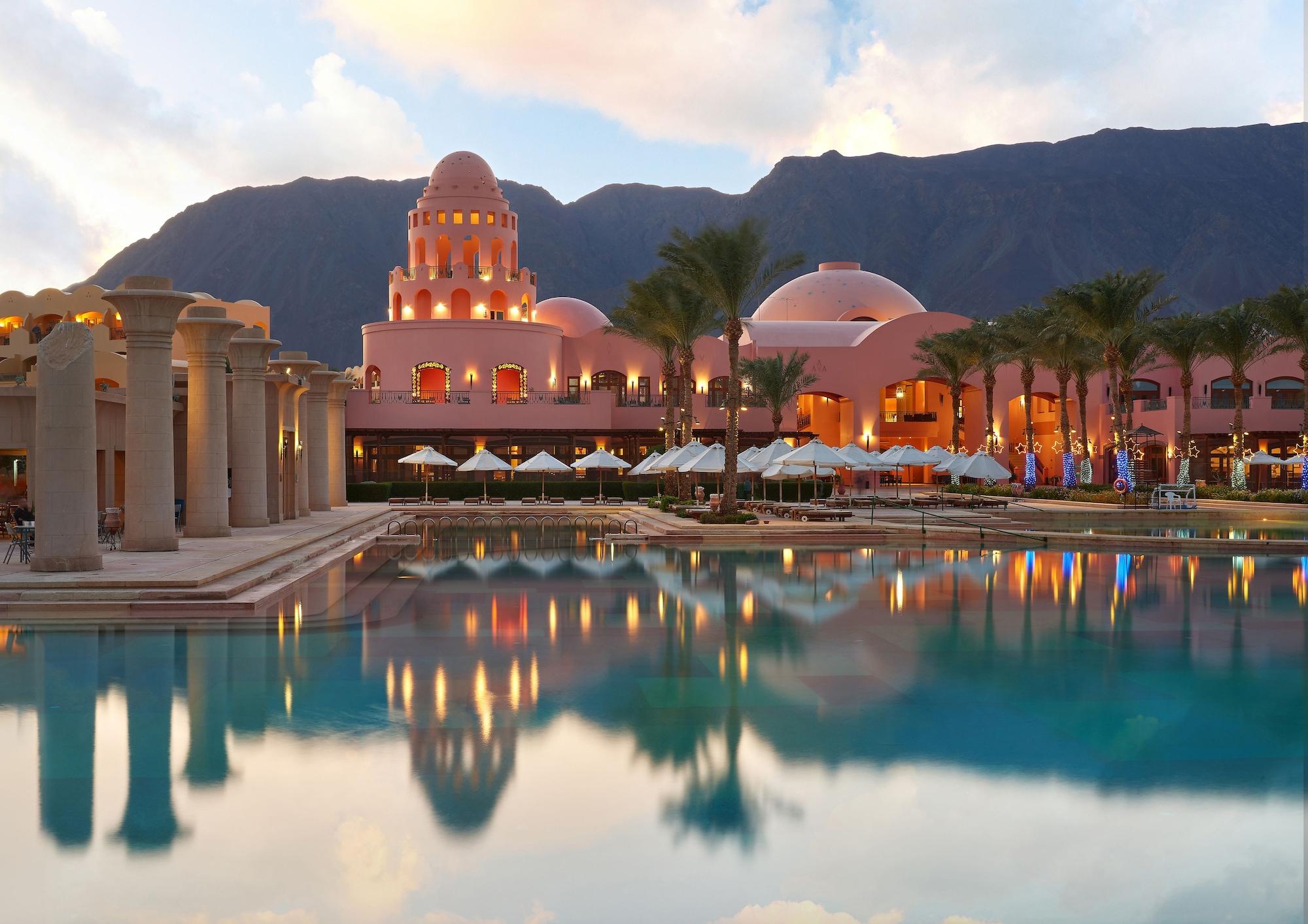 Mosaique Beach Resort Taba Heights Exterior photo The resort at sunset